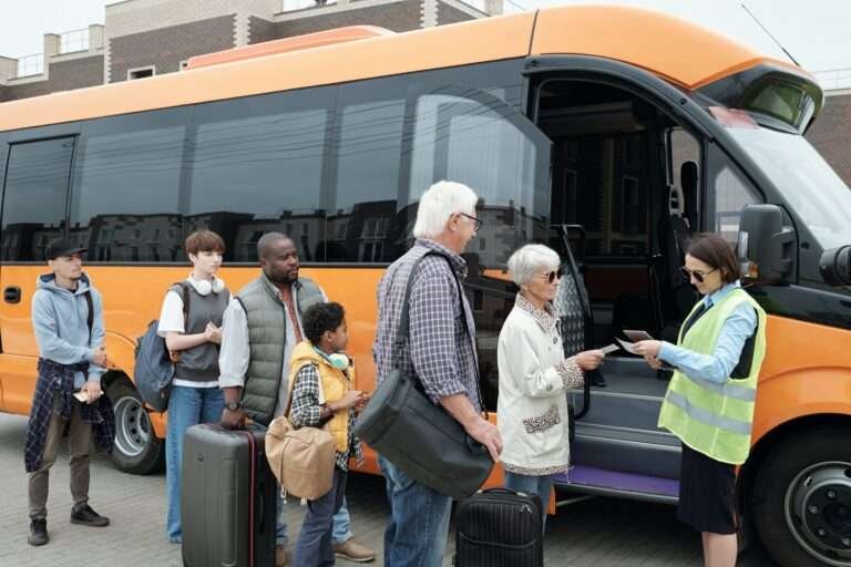 Young bus conductor checking tickets